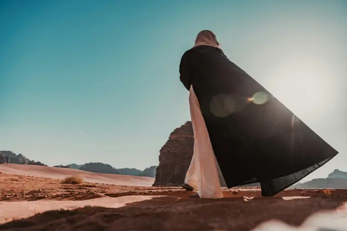 a person walking in the desert